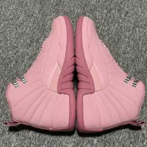 Air Jordan 12 Retro Pink Foam pink leather sneakers with metal eyelets and rubber sole