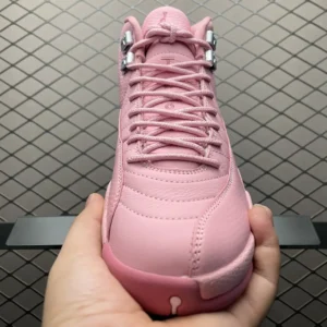 Air Jordan 12 Retro Pink Pulse leather sneakers with metal lace hooks and textured stitched upper
