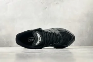 Asics Gel-Coffee 14 sneaker in black, showcasing mesh upper and lacing details, set against a neutral background, emphasizing stylish athletic footwear for purchase.