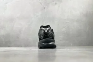 Asics Gel-Coffee 14 sneakers in black, displayed against a gray background, showcasing the rear view and design details.