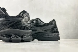 ASICS Gel-Coffee 14 sneakers in black, showcasing sleek design and mesh detailing against a neutral background.