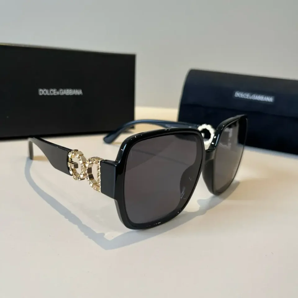 Dolce & Gabbana sunglasses black frame dark lenses gold double D logo accents