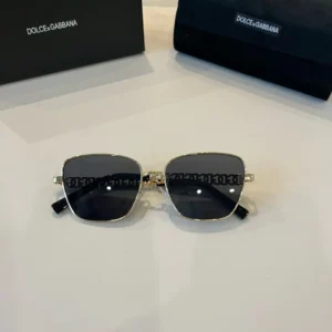 Dolce & Gabbana sunglasses gold frame black lenses metal and acetate accessories with logo case