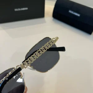 Dolce & Gabbana sunglasses black gold chain detail metal frame with grey lenses accessory