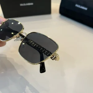 Dolce & Gabbana sunglasses gold metal frame black lenses luxury designer accessory