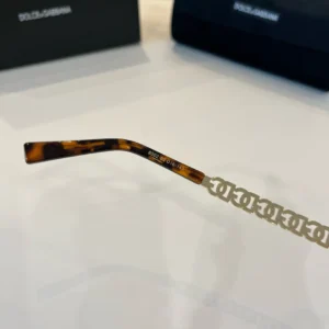 Dolce & Gabbana eyeglasses tortoiseshell frame metal chain temple accessory brown acetate