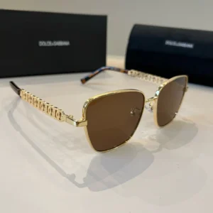 Dolce & Gabbana sunglasses gold frame brown lenses metal temples with logo chain design