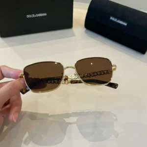 Dolce & Gabbana sunglasses gold frame brown lenses metal acetate temples with chain detail