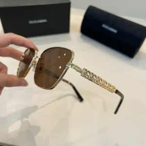 Dolce & Gabbana sunglasses gold frame brown lenses chain link temples luxury accessory