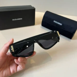 Dolce & Gabbana sunglasses black acetate frame dark lenses gold accent hinges with branded case and box