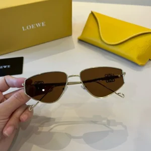 Loewe sunglasses gold metal frame brown lenses with yellow leather case and branded packaging