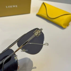 Loewe sunglasses black lenses silver metal frame gold logo detail accessory with yellow leather case