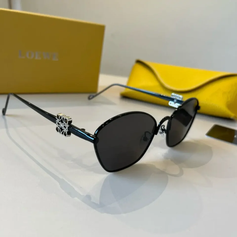 Loewe sunglasses black metal frame dark lenses LOEWE logo on temples with yellow leather case