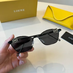 Loewe sunglasses black frame dark lenses metal detail leather yellow case