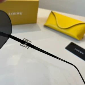 Loewe sunglasses black frame silver logo metal temples lightweight design with yellow leather case and black card