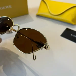 Loewe sunglasses gold metal frame brown lenses luxury design accessory with yellow case