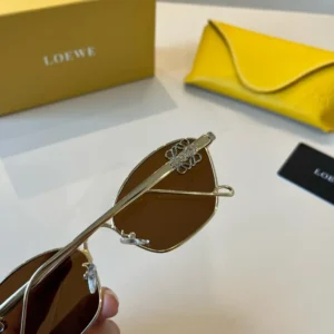 Loewe sunglasses brown lenses gold metal frame luxury eyewear with embossed logo detail