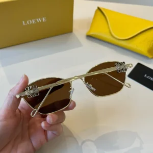 Loewe sunglasses gold metal frame brown lenses logo detail luxury accessory with yellow leather case
