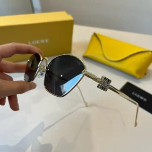 Loewe sunglasses grey lenses silver metal frame with decorative hinge yellow leather case