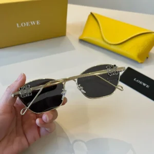 Loewe sunglasses gold frame black lenses metal accessories with yellow leather case