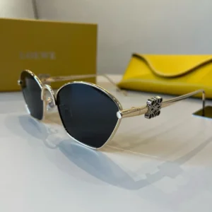 Loewe sunglasses gold frame black lenses metal eyewear with signature logo detail on temples
