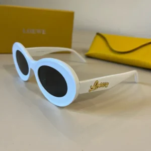 Loewe sunglasses white frame black lenses gold logo detail acetate material with yellow case in background