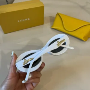Loewe sunglasses white acetate frame black lenses gold logo accents with yellow leather case and box