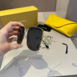 Loewe Square sunglasses gold metal frame black lenses with decorative logo temples and yellow case