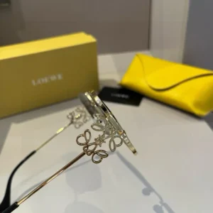 Loewe sunglasses gold metal frame butterfly detail black temples accessory with yellow leather case and box