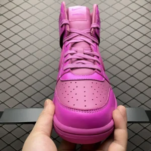 Nike Dunk High Ambush pink colorway leather sneakers with perforated toe box and branded tongue patch