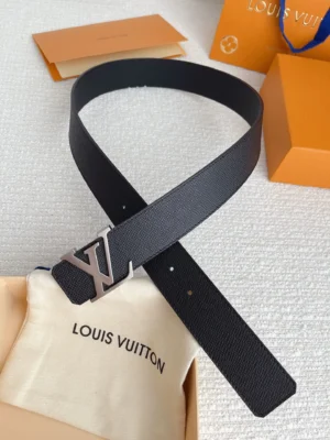 Louis Vuitton men's palm print belt with stainless steel buckle, displayed on a soft pouch, emphasizing quality and luxury.