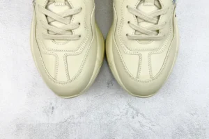 New Balance 550 cream white leather sneakers with stitched detailing and lace-up design