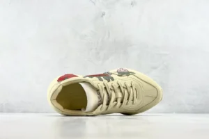 Gucci Rhyton sneakers cream leather with colorful cartoon print and lace-up closure