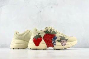 Gucci Rhyton sneaker beige leather with red strawberry graphic print and blue logo detailing sneakers
