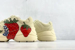 Gucci Rhyton sneakers beige leather with large red strawberry print and blue logo detail