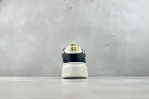 Gucci Screener leather sneakers black white gold logo rubber sole detailed heel