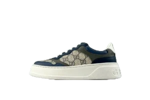 Gucci sneaker featuring a distinctive design with a beige and navy color scheme, showcasing the iconic GG logo, ideal for fashion enthusiasts and sneaker collectors.