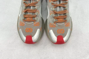 Gucci Rhyton GG embroidered grey orange fabric sneakers with red toe caps and lace-up closure