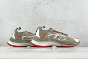 Nike Air Zoom Alphafly Next% grey orange white knit sneakers with cushioned sole and red outsole