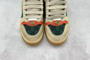 Gucci Screener Distressed Leather shoes featuring iconic green and red accents, logo detail, and textured upper on a neutral background.
