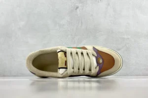 Gucci Screener distressed leather sneaker viewed from above, featuring a brown and cream color scheme, showcasing premium craftsmanship and luxury design.