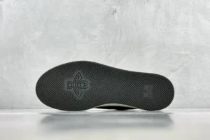 Bottom view of Gucci Screener distressed leather sneaker showcasing textured sole and logo detail.