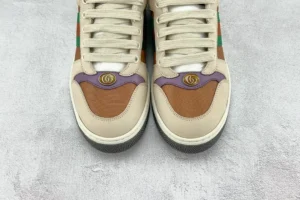 Gucci Screener distressed leather sneakers with multi-colored accents and logo detail, featured for luxury footwear purchase.