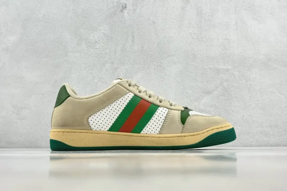 Stylish sneaker with green and orange stripes