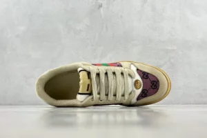 Gucci Screener Distressed Leather sneaker showcasing a top view with beige and purple design, featuring the iconic logo and colorful accents.