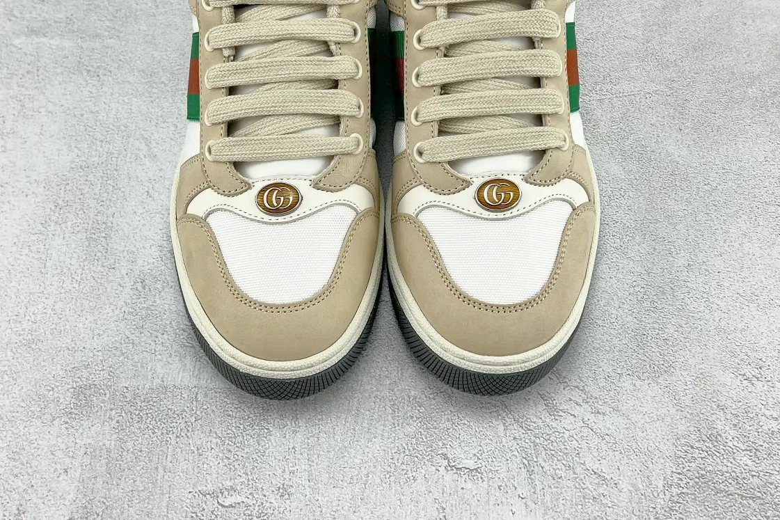Gucci Screener Distressed Leather sneakers featuring beige suede and white mesh, showcasing the iconic GG logo on the tongue.