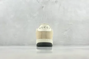 Gucci Screener Distressed Leather sneaker rear view highlighting logo and design features.
