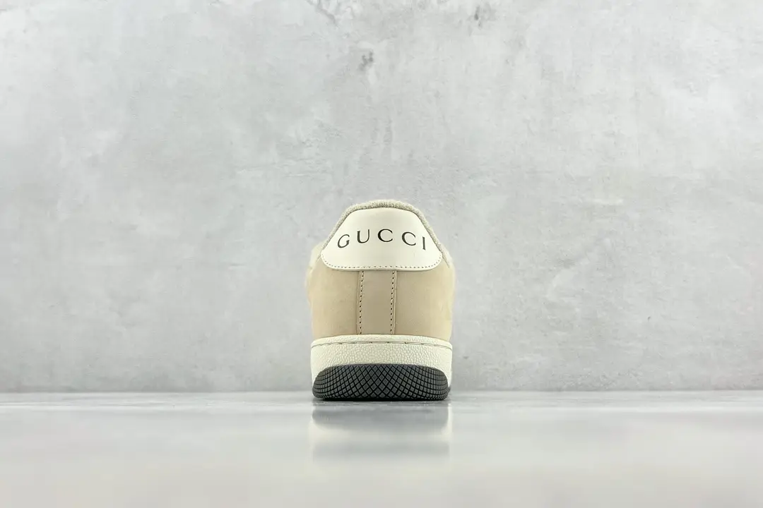 Gucci Screener Distressed Leather sneakers viewed from the back, showcasing the logo and design details against a neutral background.