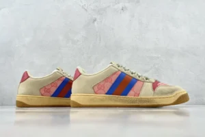 Gucci Screener Series GG Enamel used small dirty shoes with red and blue stripes on beige canvas, displayed on a neutral background, emphasizing luxury replica footwear.