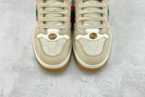 Gucci Screener Series GG Enamel used sneakers featuring beige upper, logo detail, and colorful accents, showcasing their condition as small and dirty.